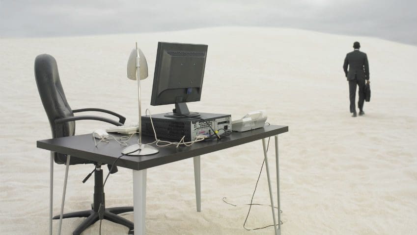 Man walking away from desk in the desert | Cloud Surfing Media Digital Marketing